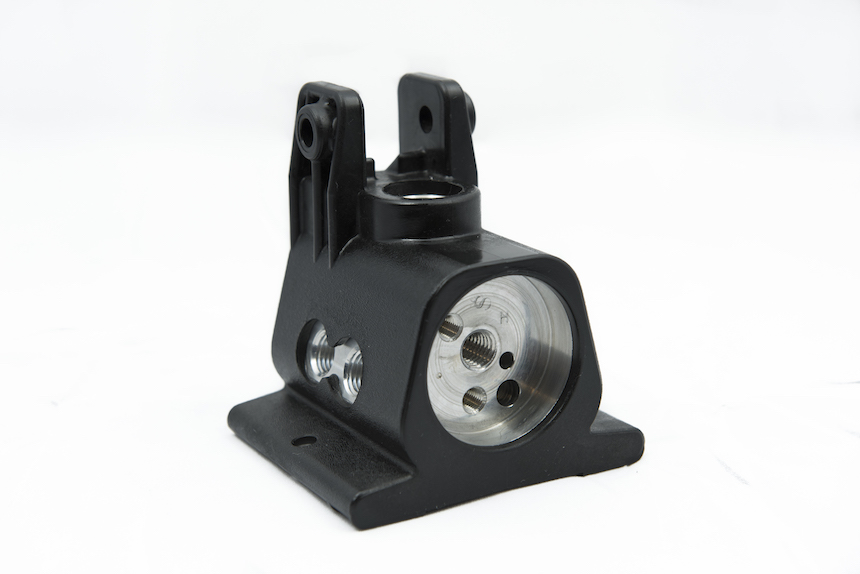 CNC machined hand pump base with precision bore