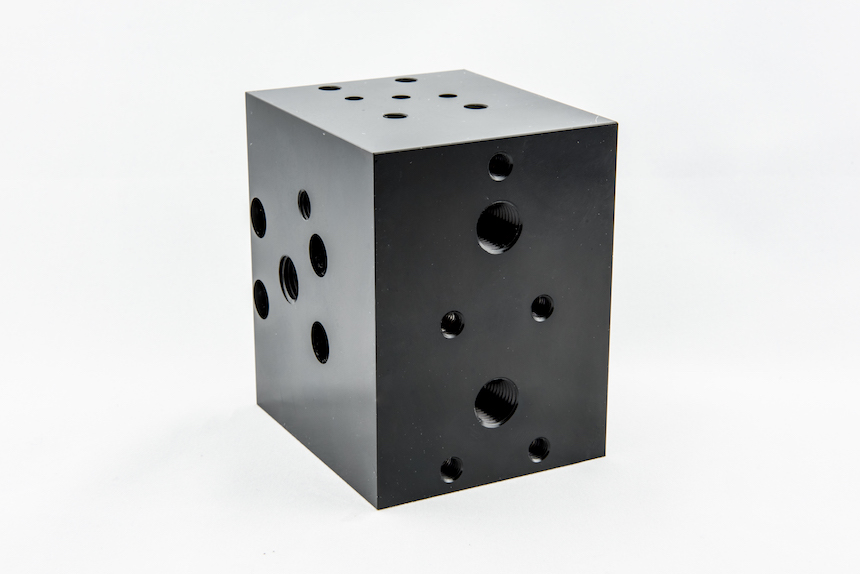 CNC machined valve block with threaded ports