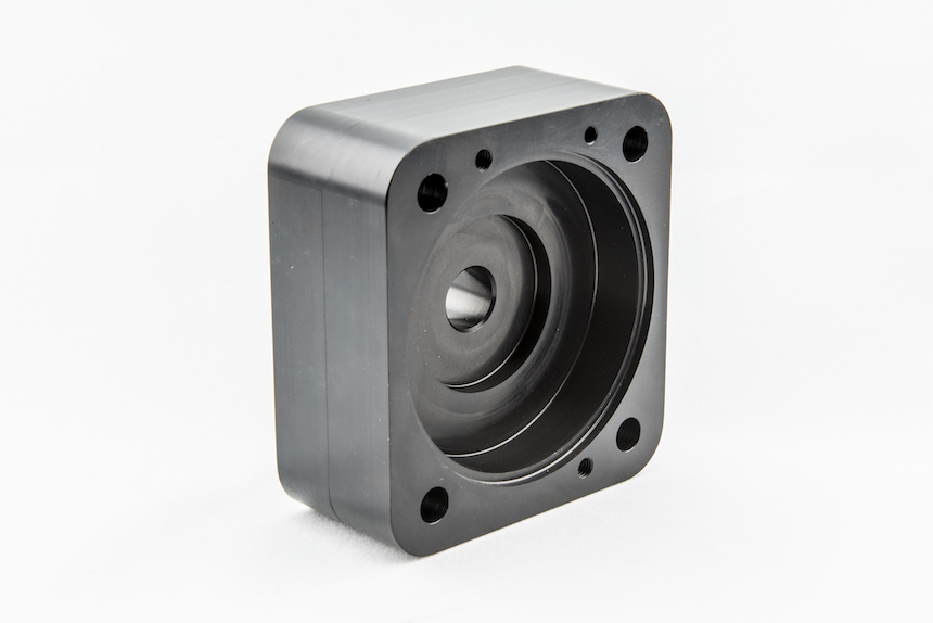 CNC machined pump housing with concentric bore and mounting flange