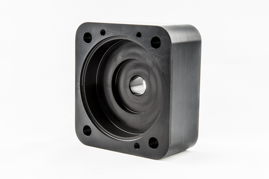 Pair of CNC machined pump housings showing production repeatability