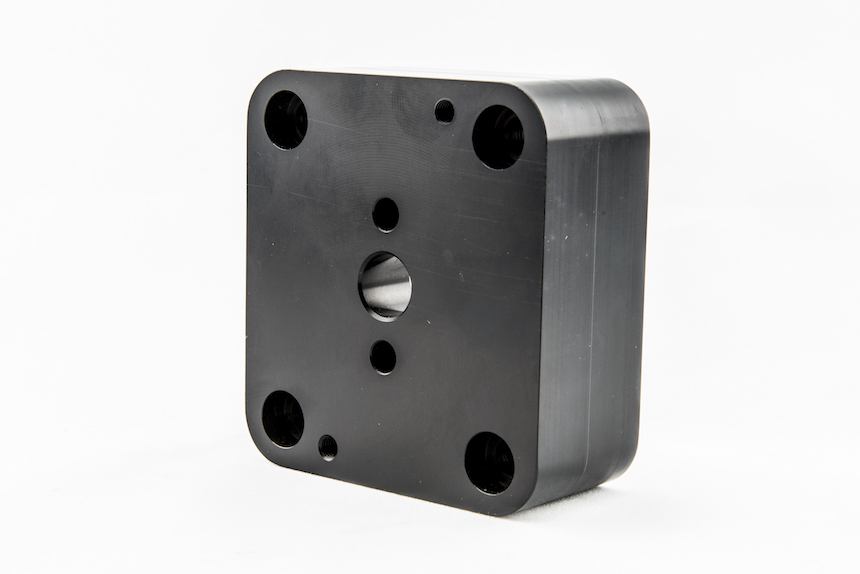 CNC machined pump housing with precision bore pattern